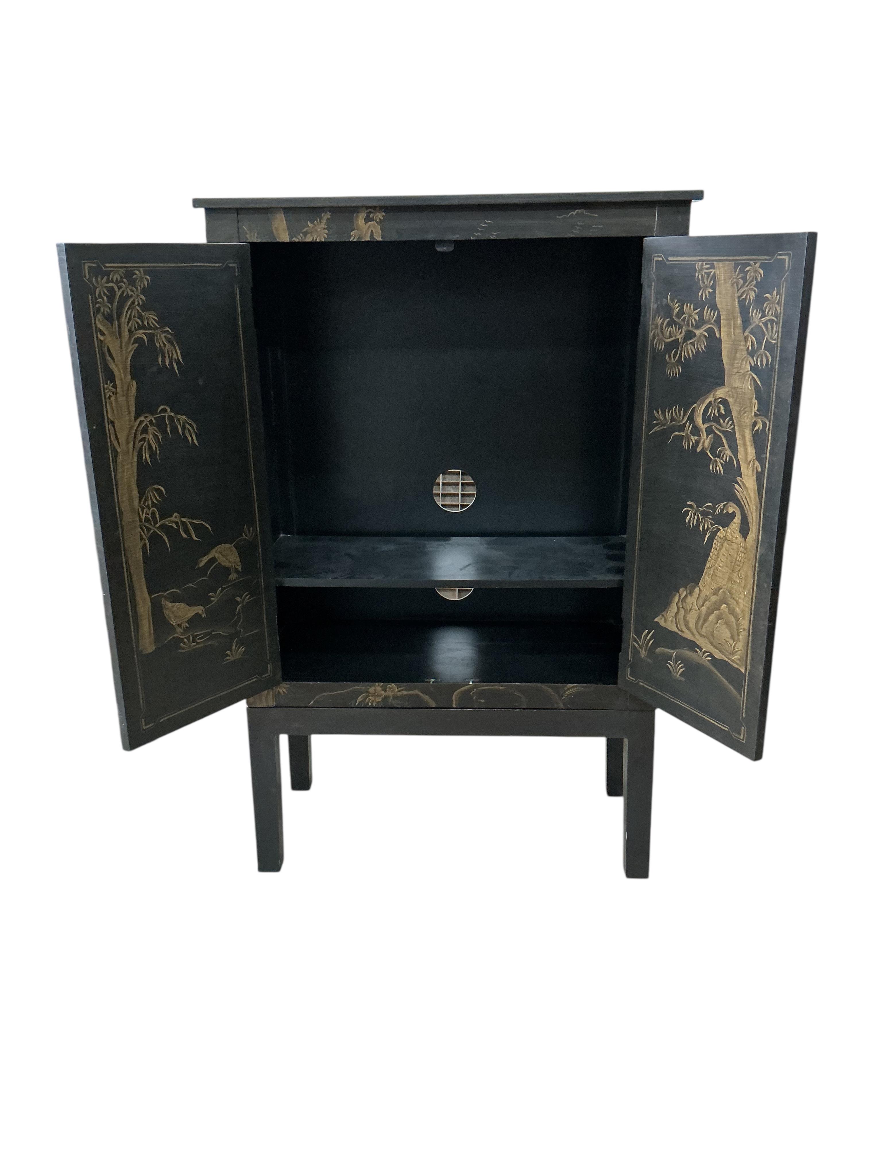 An OKA 'Peking' television cabinet, width 90cm, depth 46cm, height 140cm